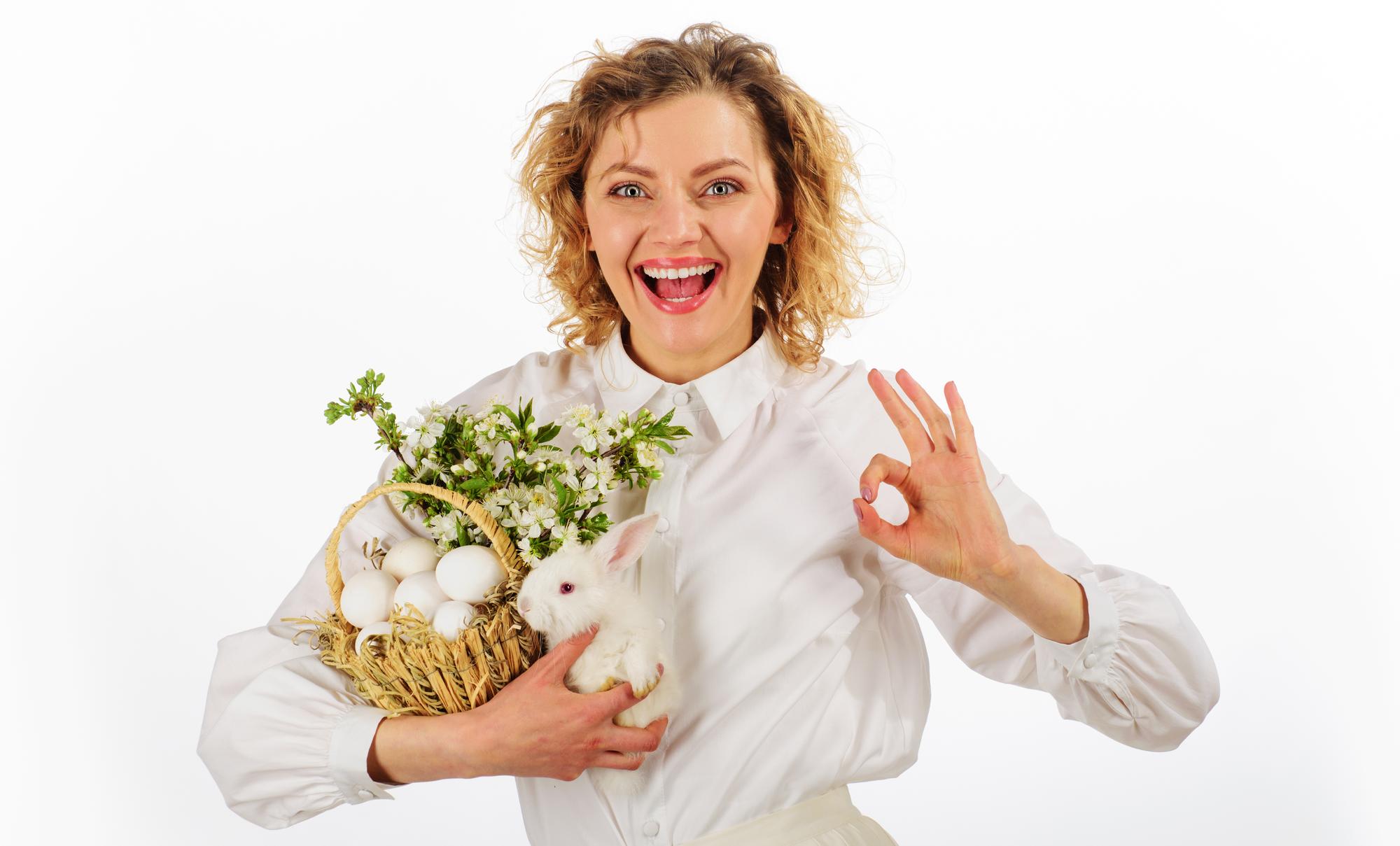 Smiling cook arranging herbs